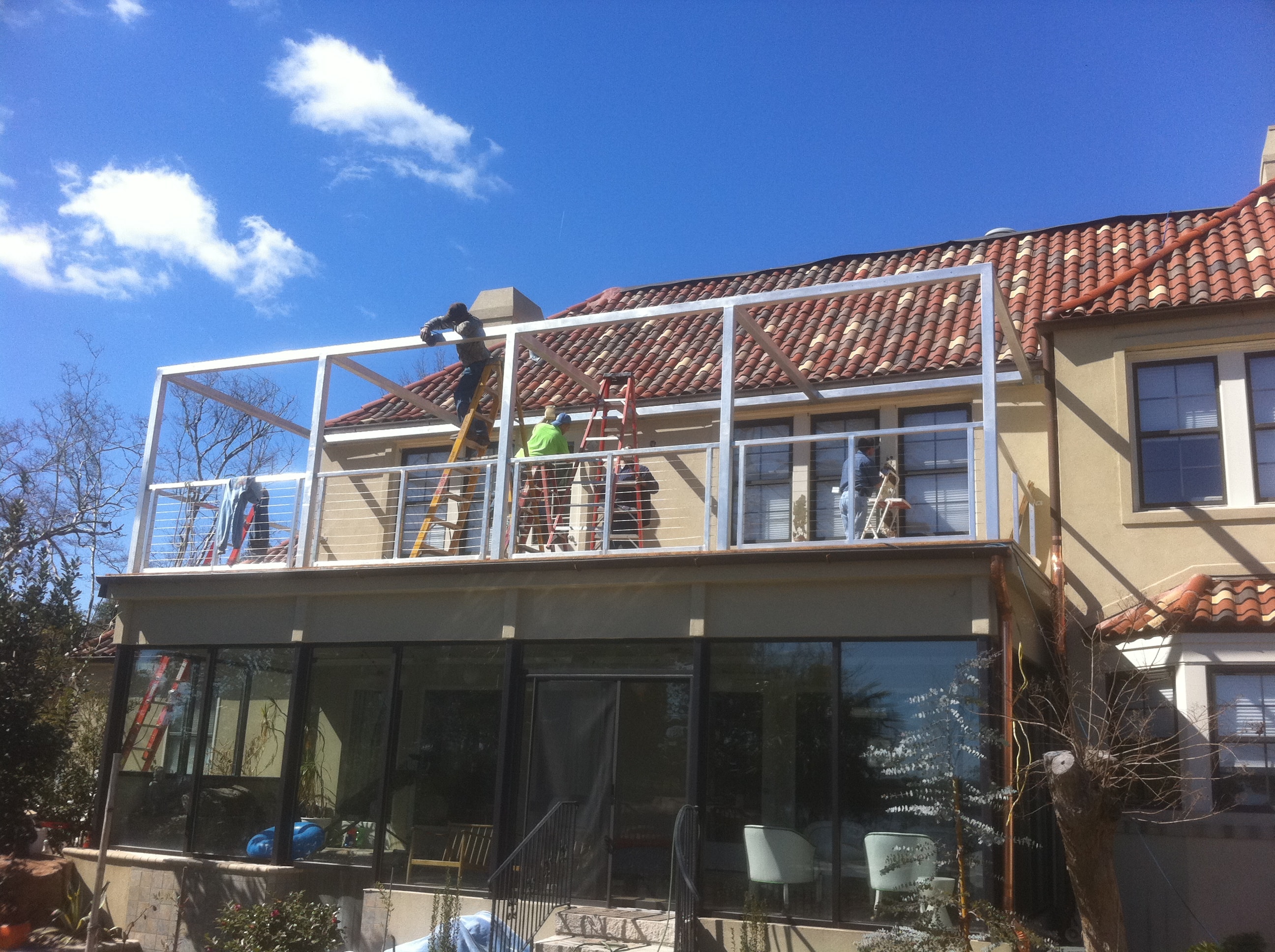 Lake House aluminum canopy frame installation in progress
