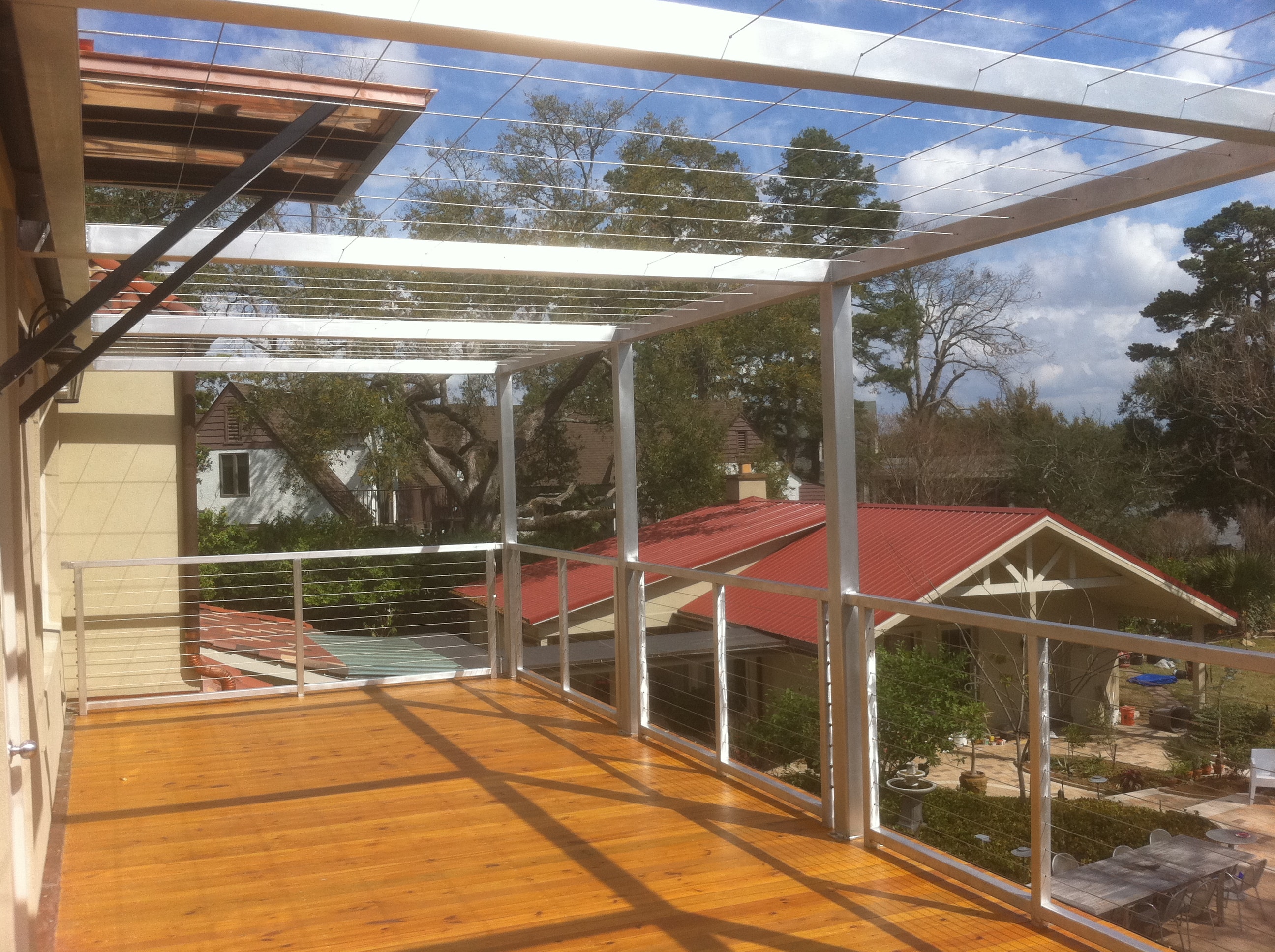 Lake House finished deck with aluminum canopy and stainless cable rail