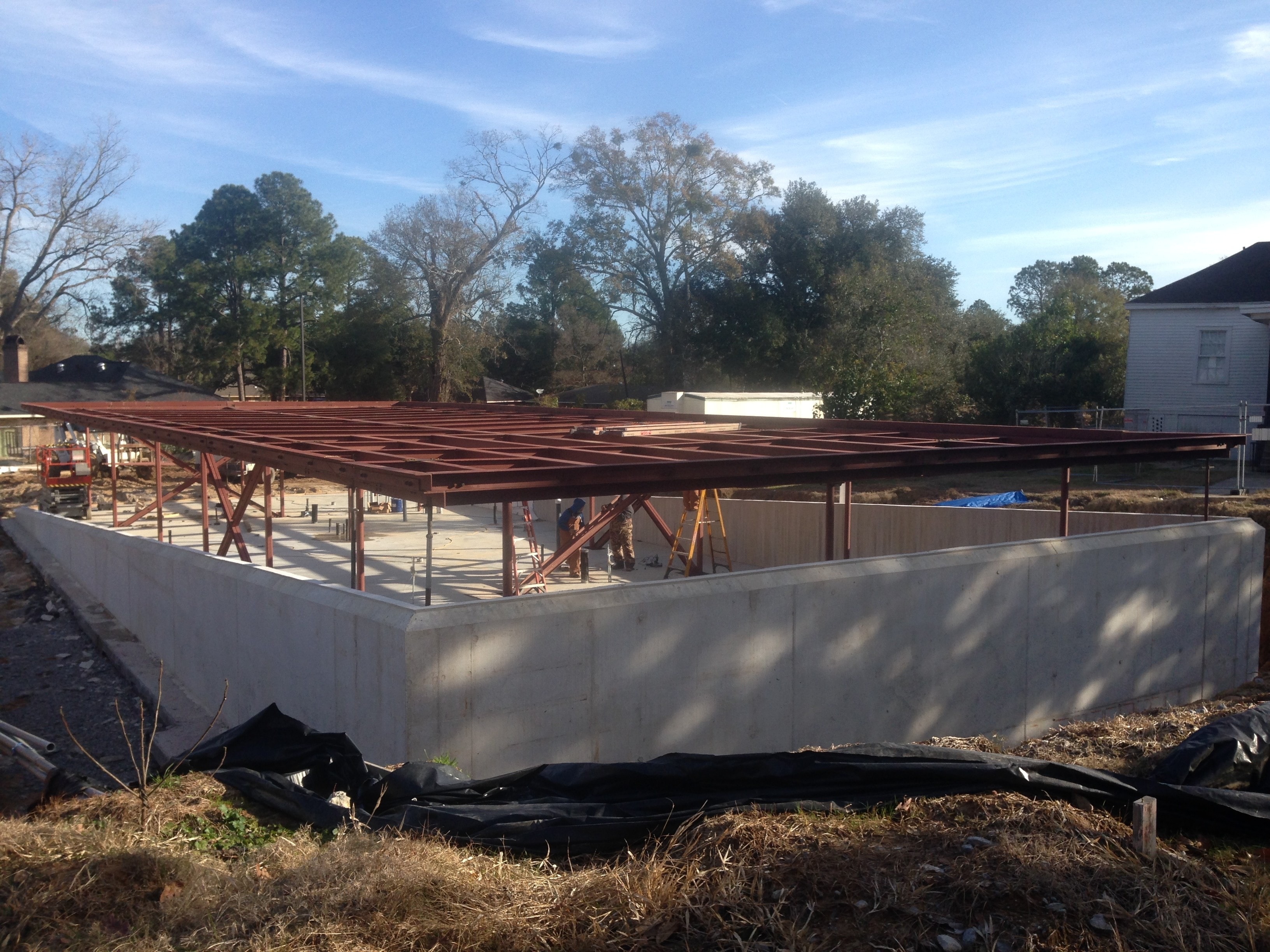 Magnolia Mound structural steel roof framing aerial view over concrete foundation walls