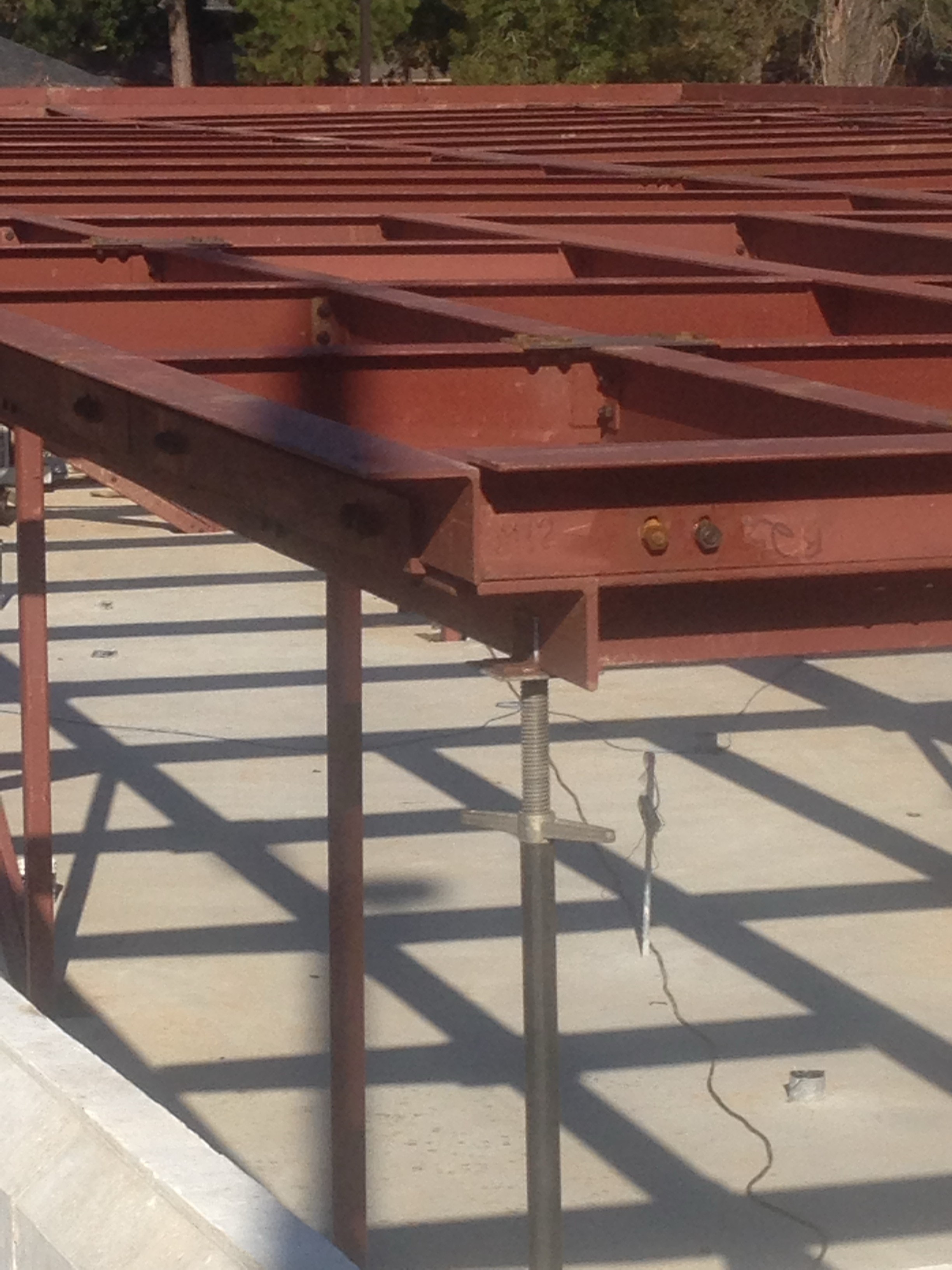 Magnolia Mound close-up of steel beam connection detail with anchor bolts and framing