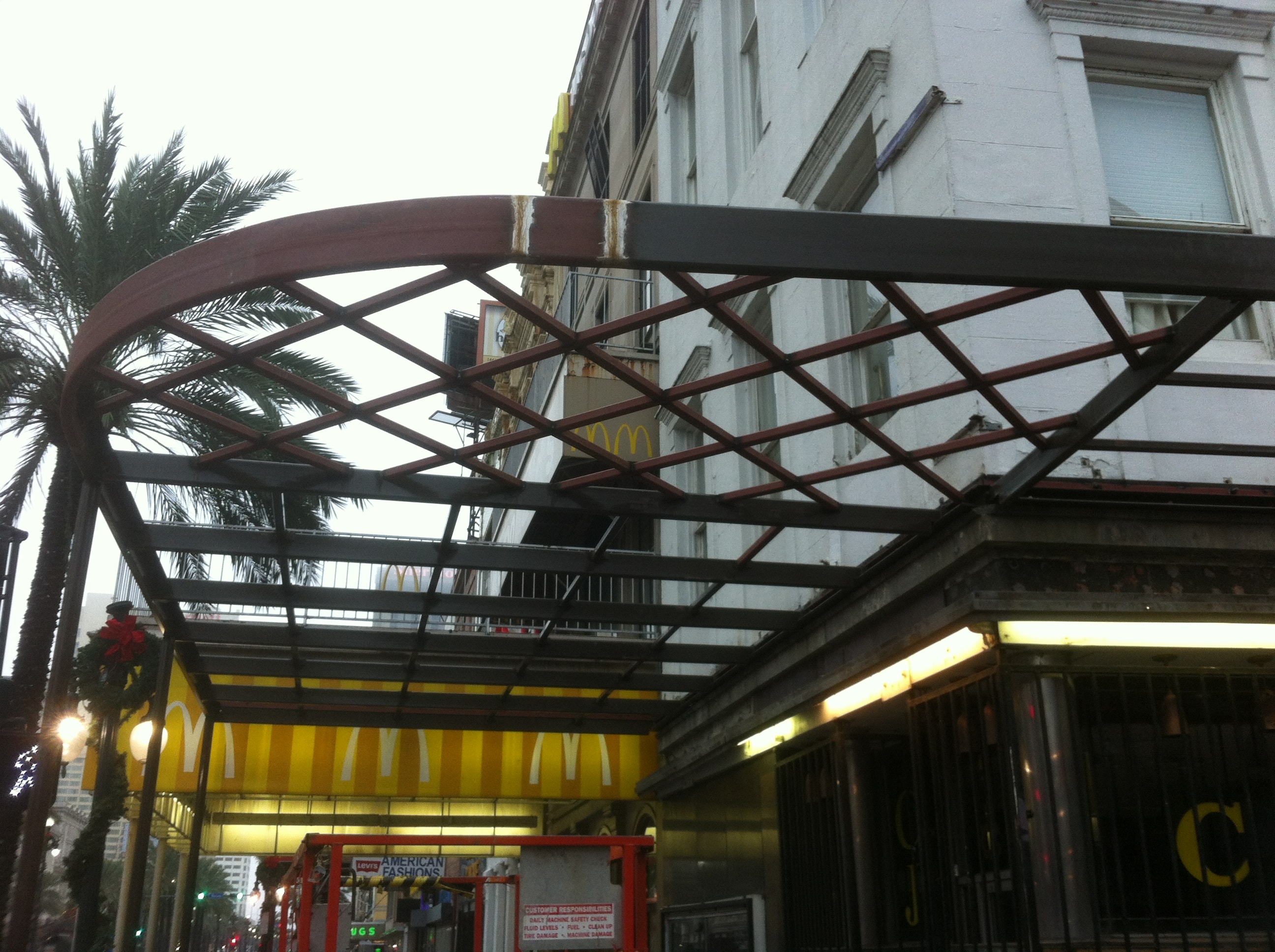 Maison Pierre Hotel canopy steel frame with curved arch member and diamond lattice pattern under construction