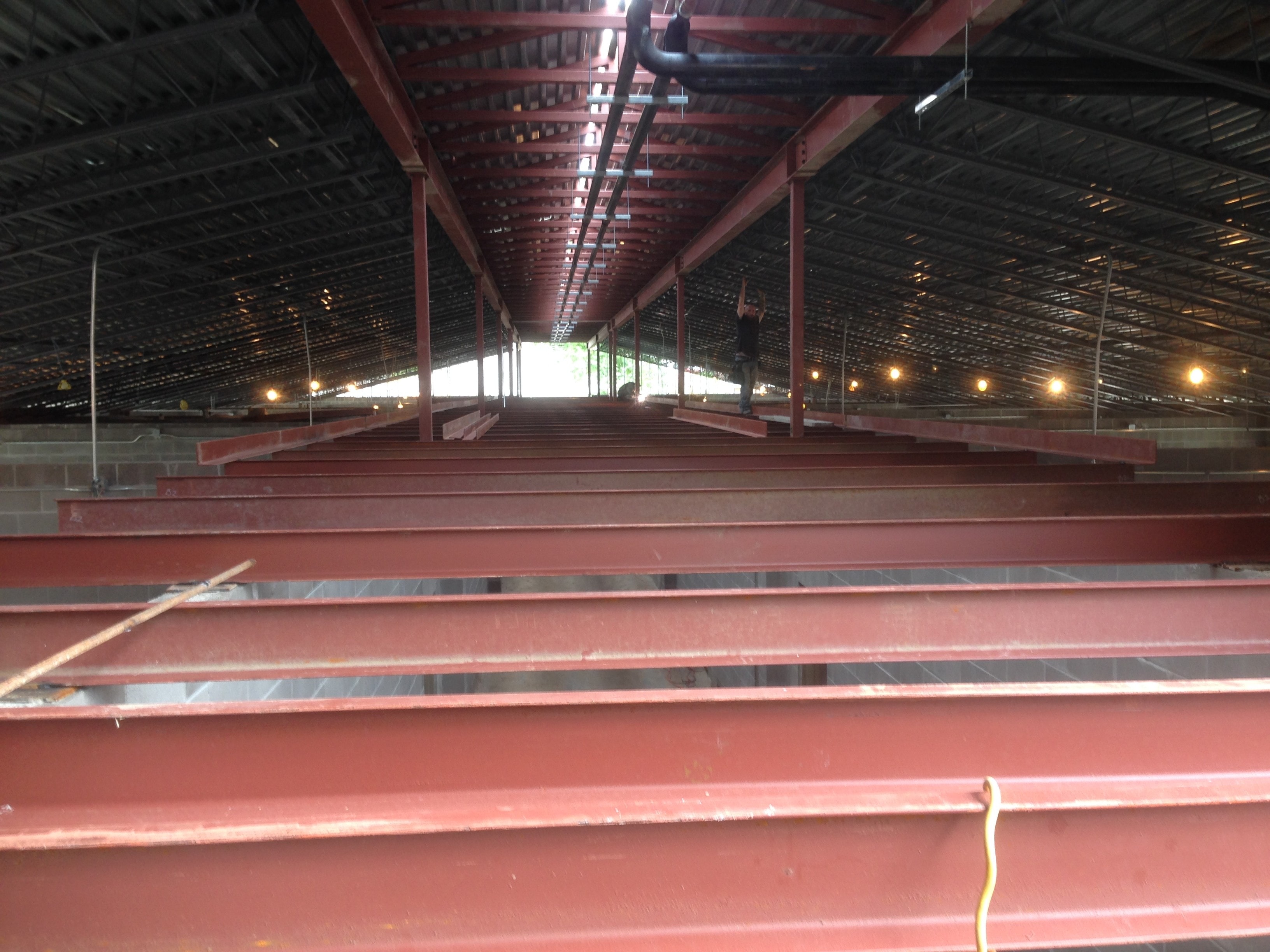 Norco Elementary Addition — interior ridge beam and bar joist with worker on top chord