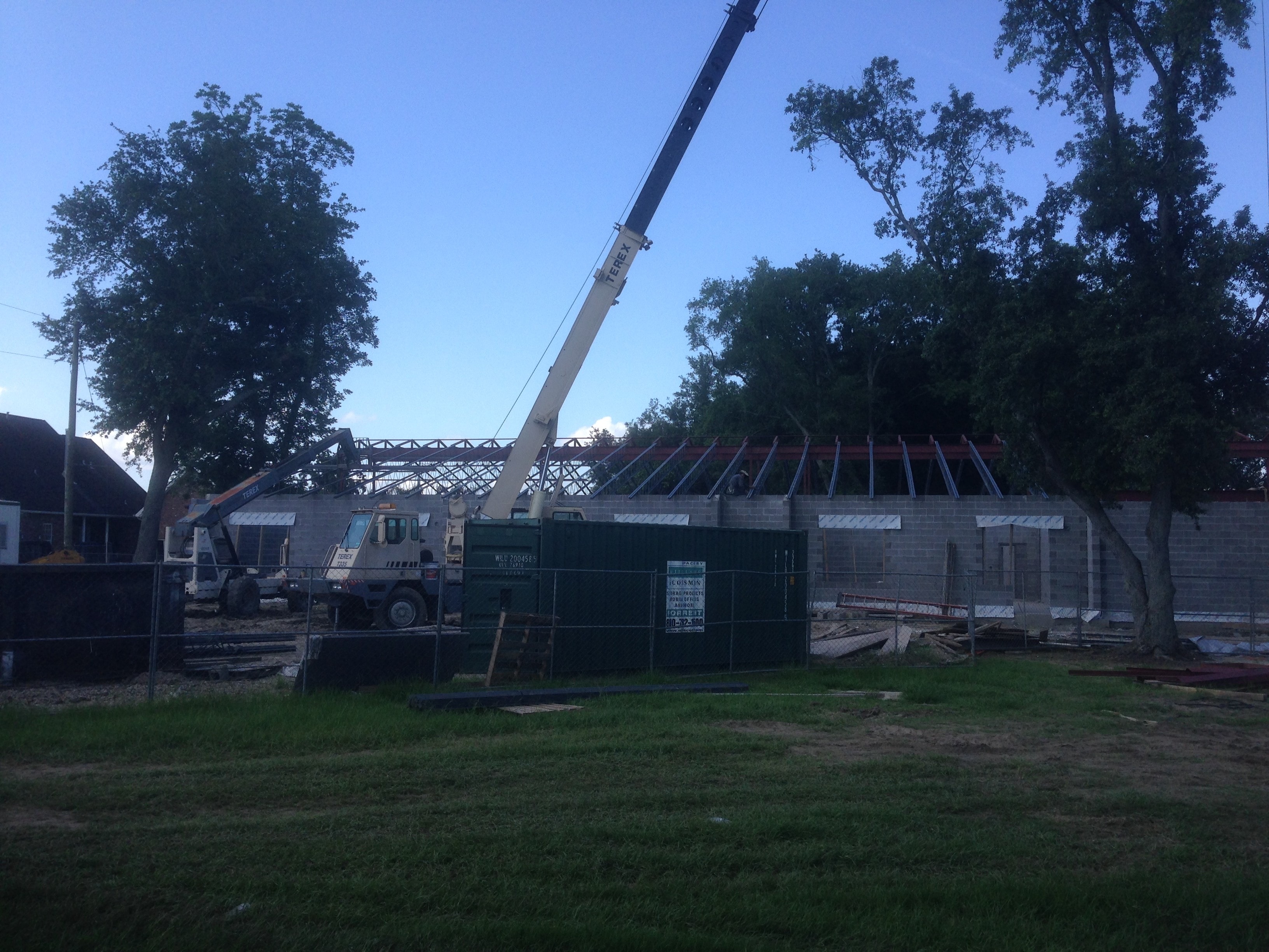 Norco Elementary Addition — Terex crane setting steel with bar joist visible on CMU walls