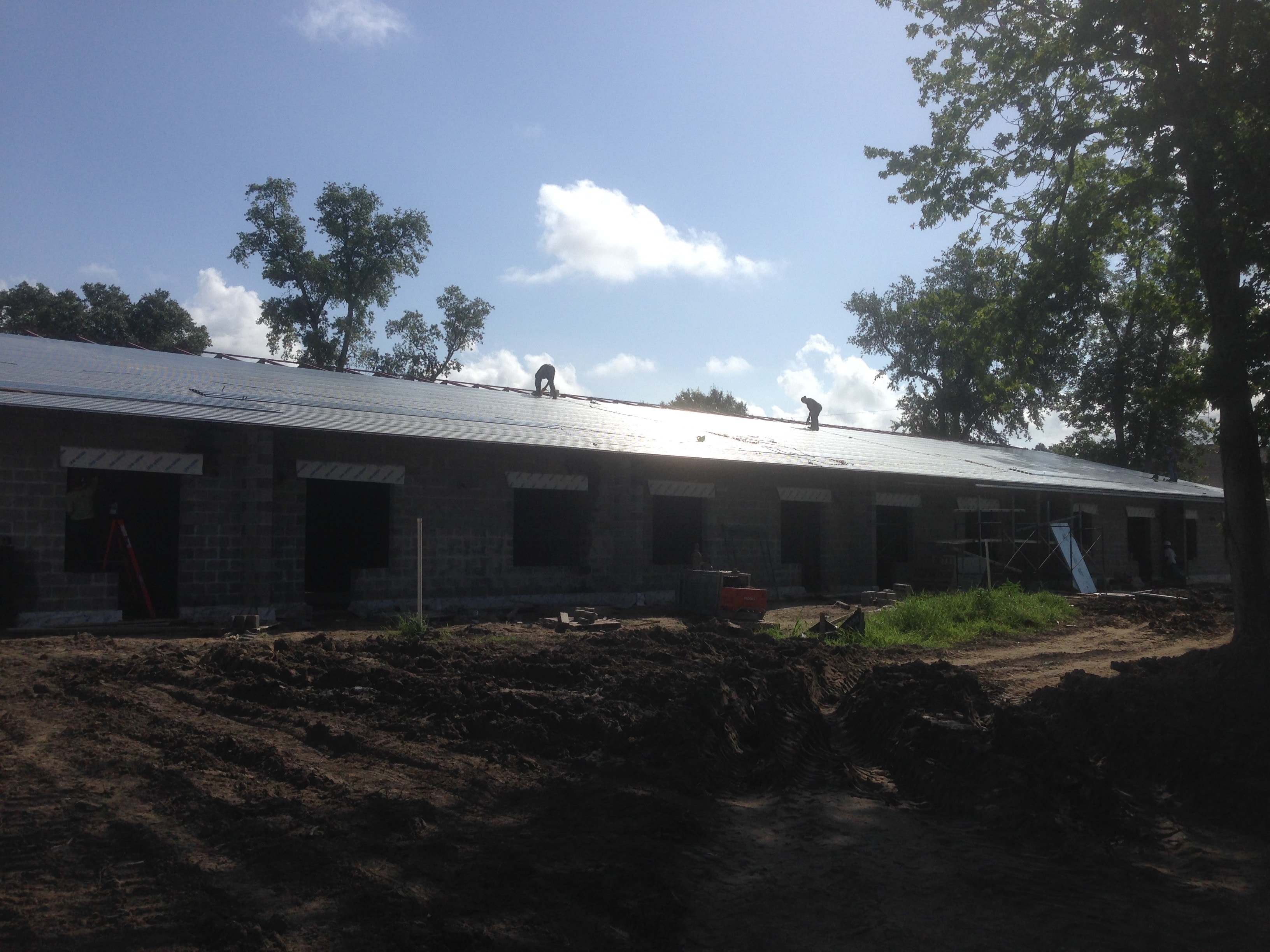Norco Elementary Addition — workers installing metal roof decking on completed bar joist