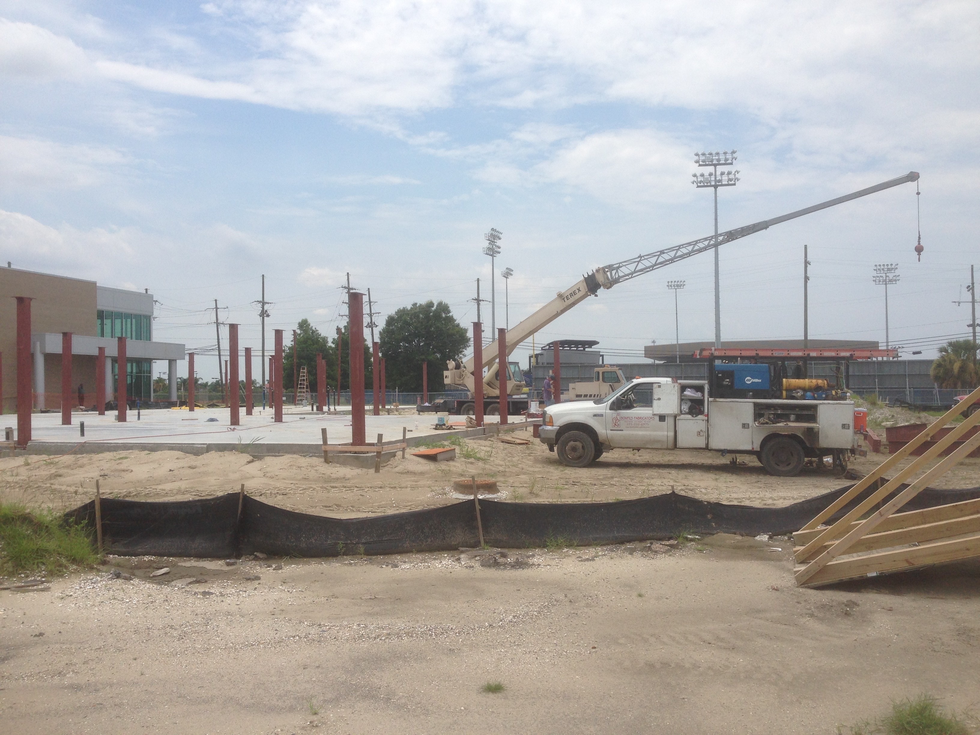 USF Business & Admin Building Addition — Terex crane setting steel with columns in background